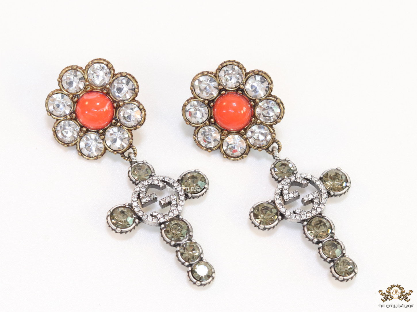 Floral cz and alphabet dangles with orange stone centre