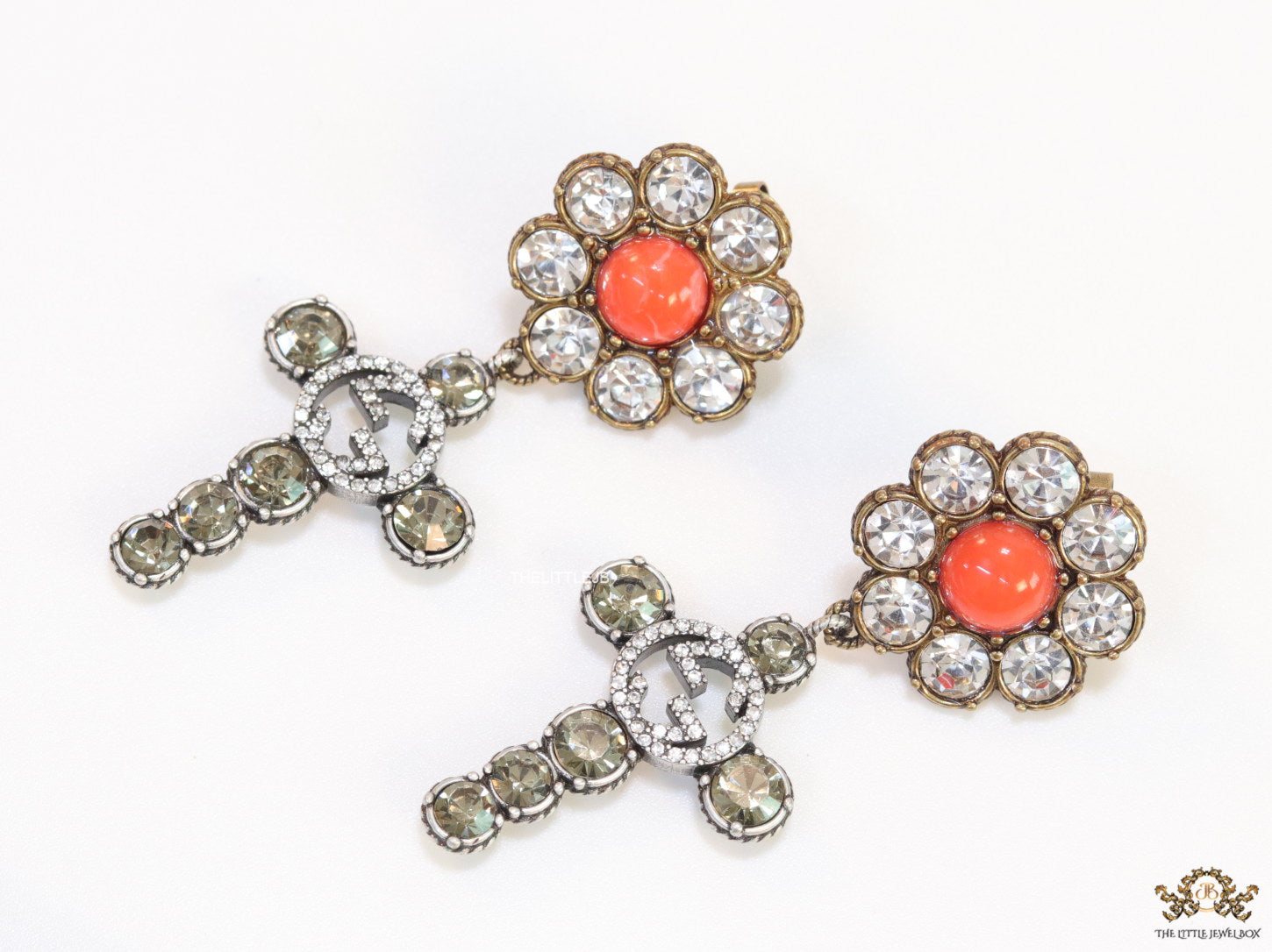 Floral cz and alphabet dangles with orange stone centre