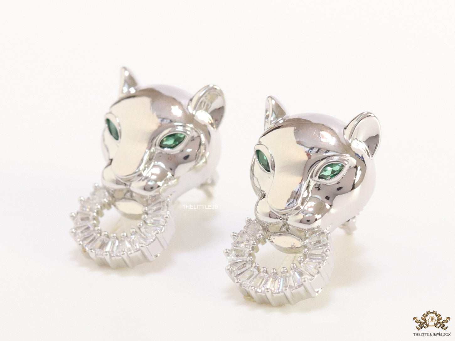 Platinum plated panther face studs with cz baguette ring