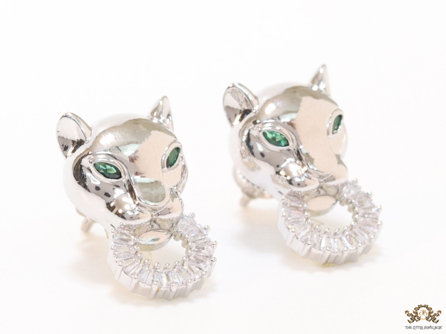 Platinum plated panther face studs with cz baguette ring