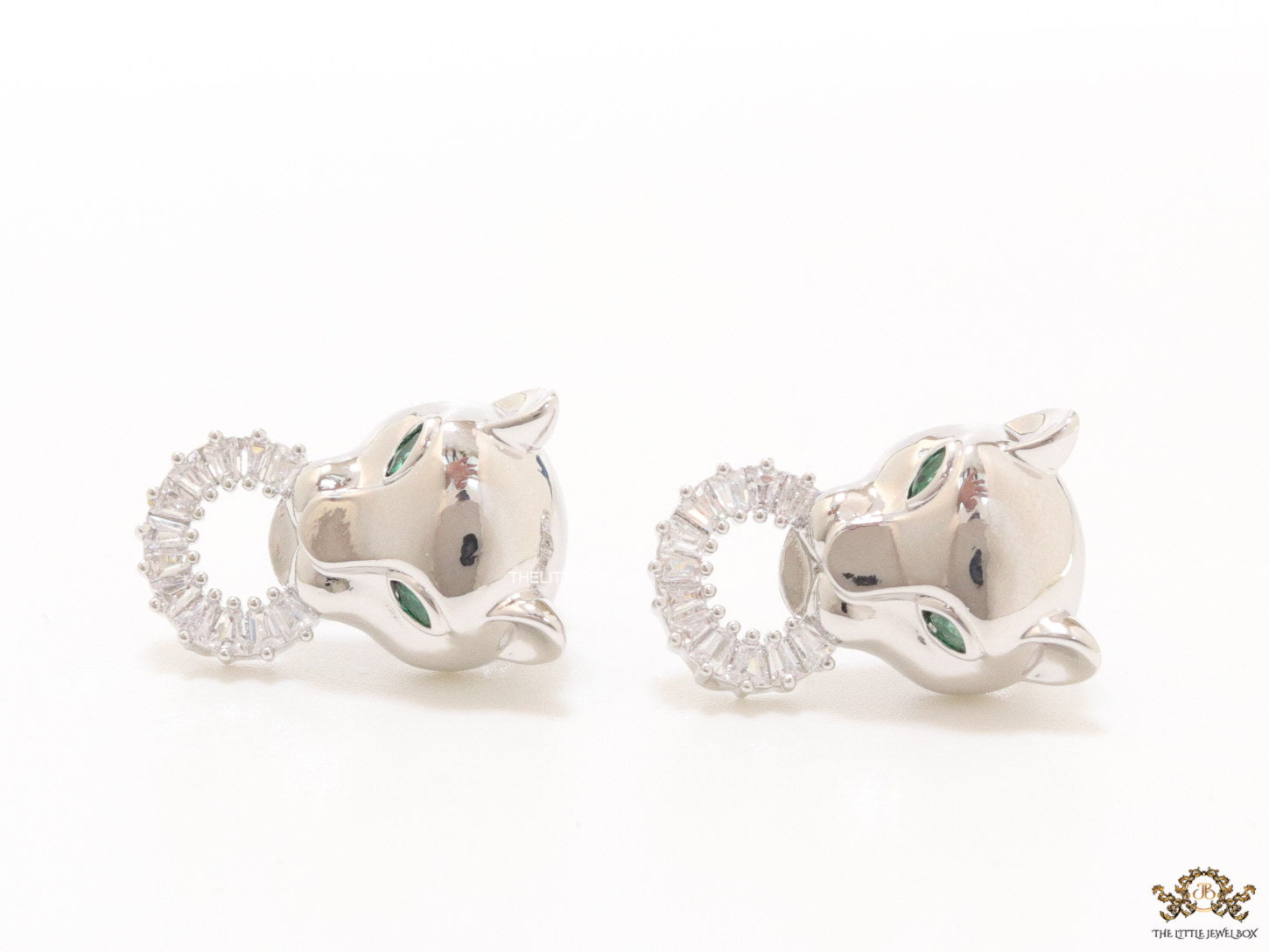 Platinum plated panther face studs with cz baguette ring
