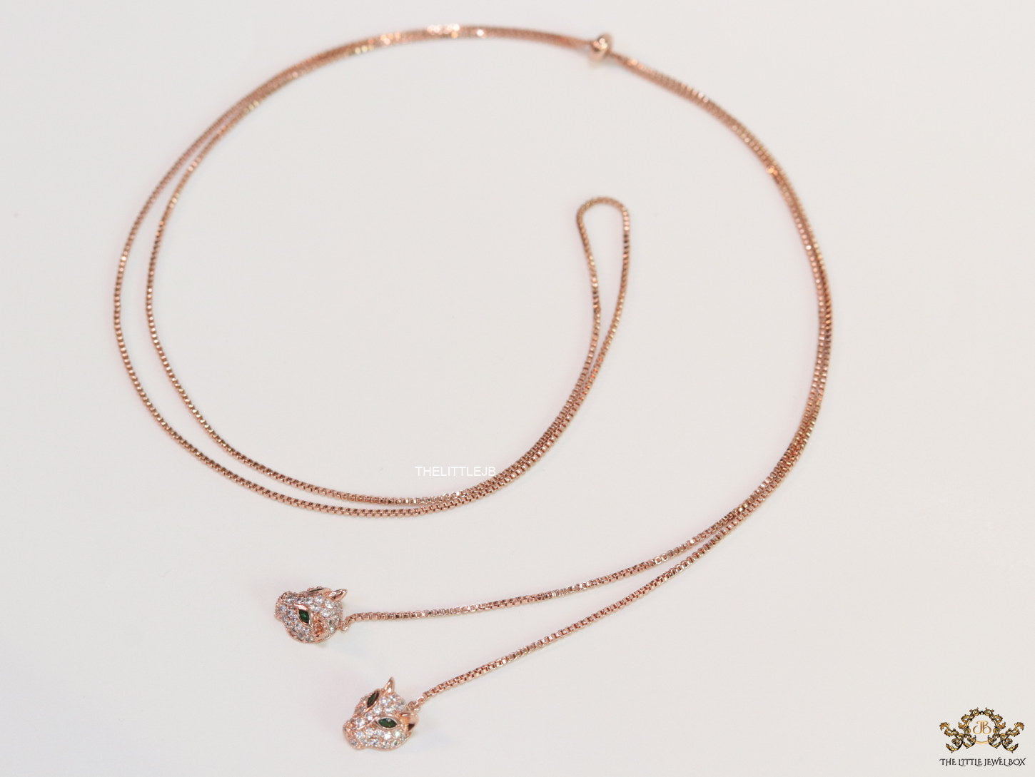 Rose gold plated knot necklace with twin cz panther pendants