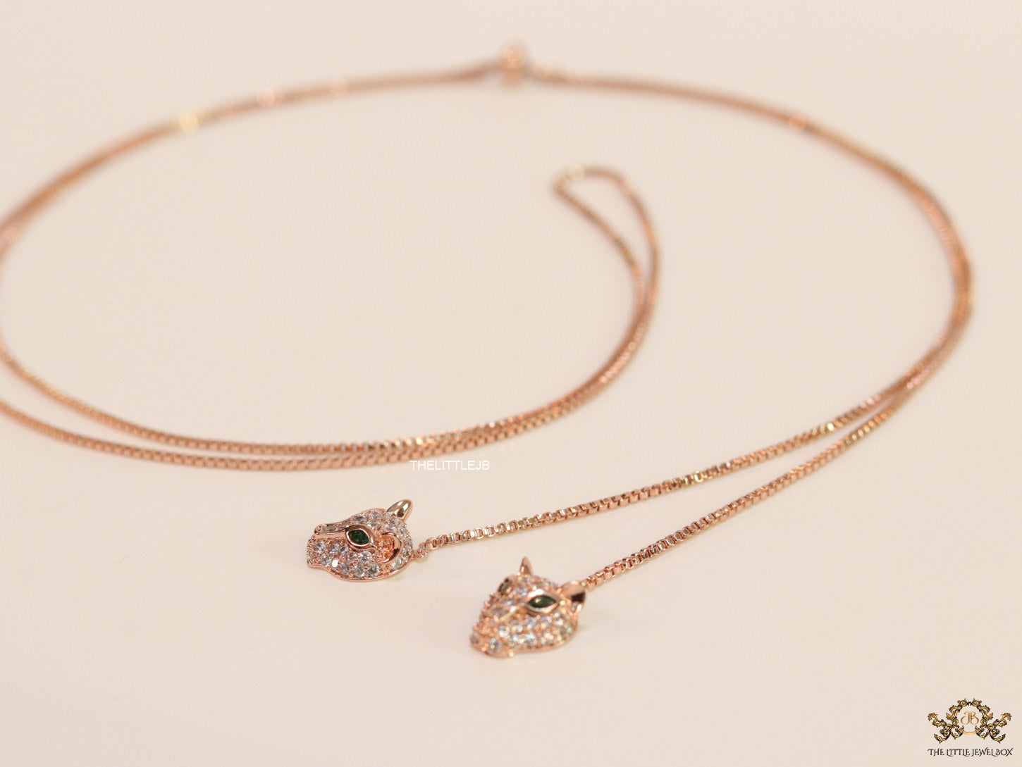 Rose gold plated knot necklace with twin cz panther pendants