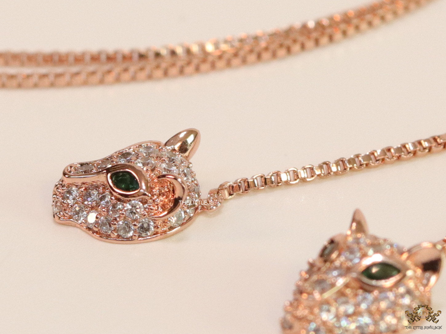 Rose gold plated knot necklace with twin cz panther pendants