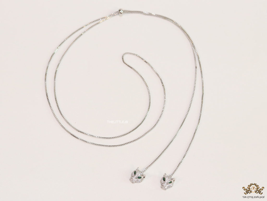 Platinum plated knot necklace with twin cz panther pendants