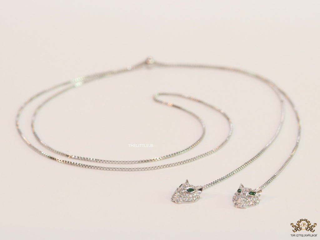 Platinum plated knot necklace with twin cz panther pendants