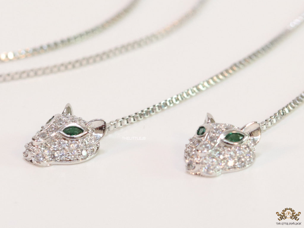 Platinum plated knot necklace with twin cz panther pendants