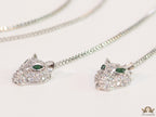 Platinum plated knot necklace with twin cz panther pendants