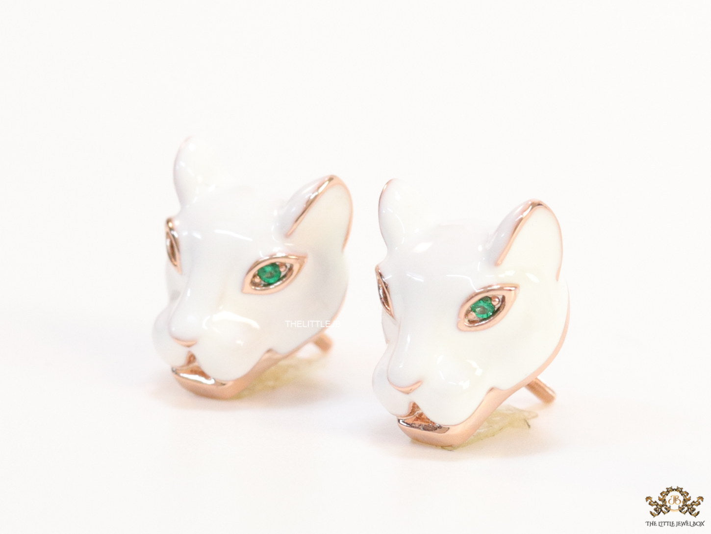 White and rose gold panther face studs