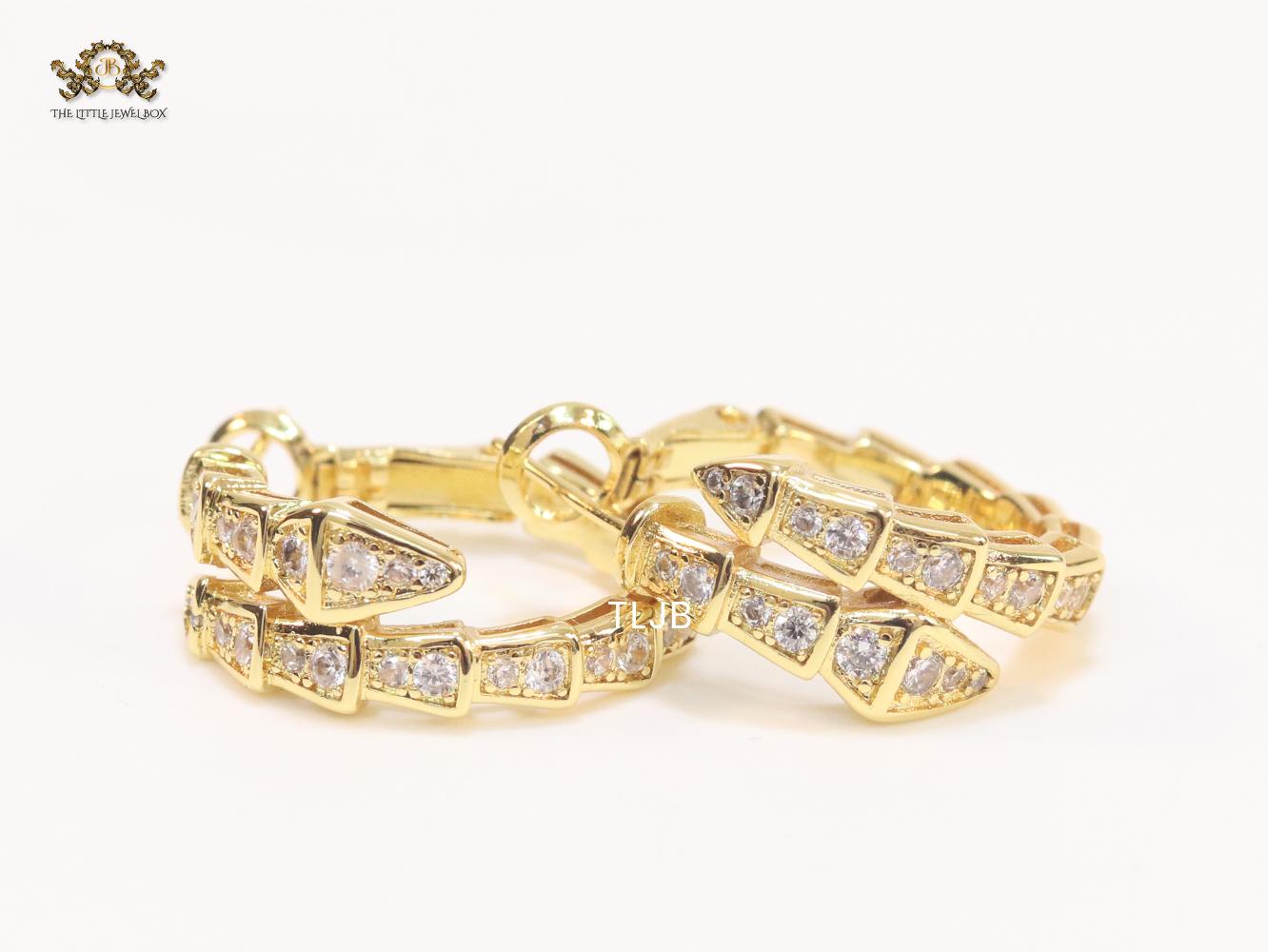 Gold serpentine hoops