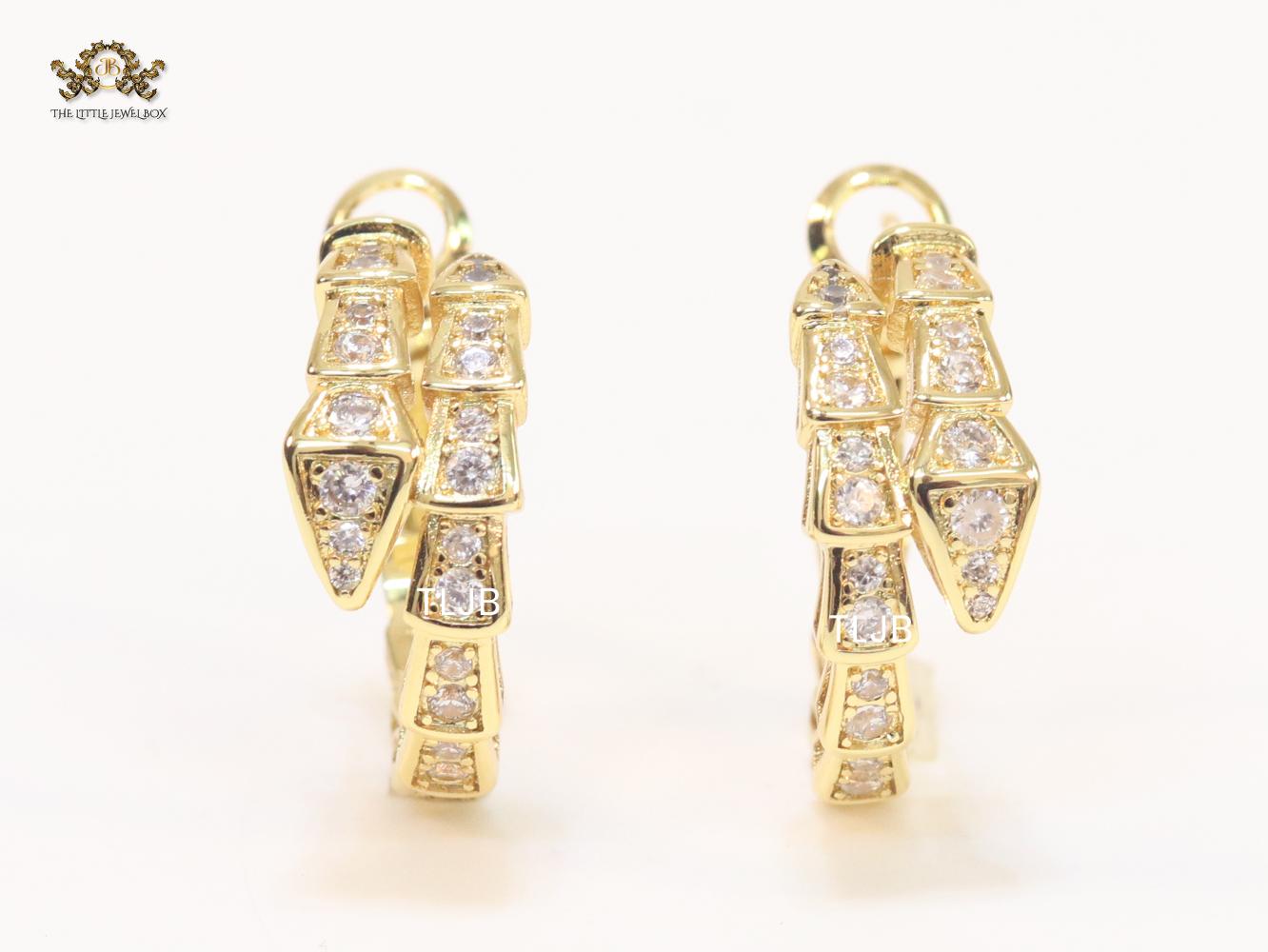 Gold serpentine hoops