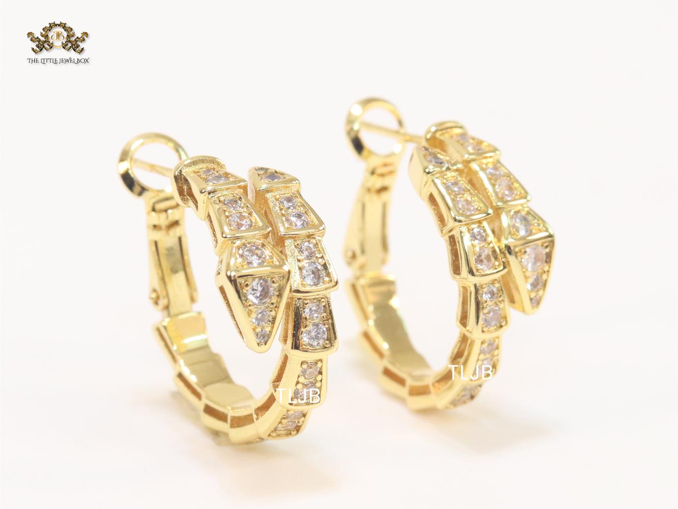Gold serpentine hoops