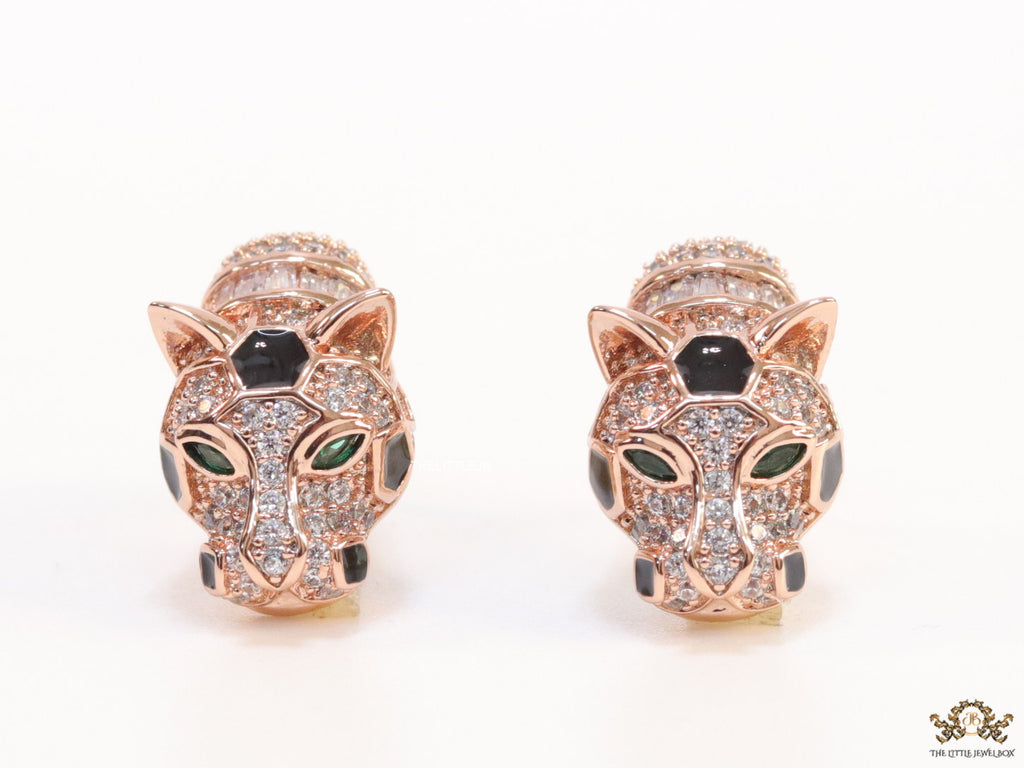 Asymmetrical cz and baguette panther studs in rose gold finish