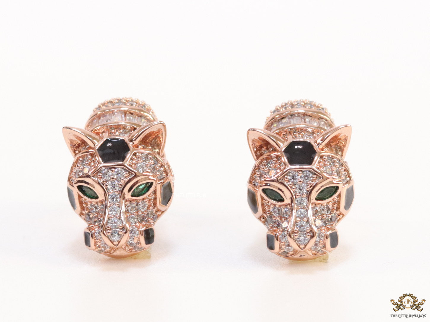Asymmetrical cz and baguette panther studs in rose gold finish