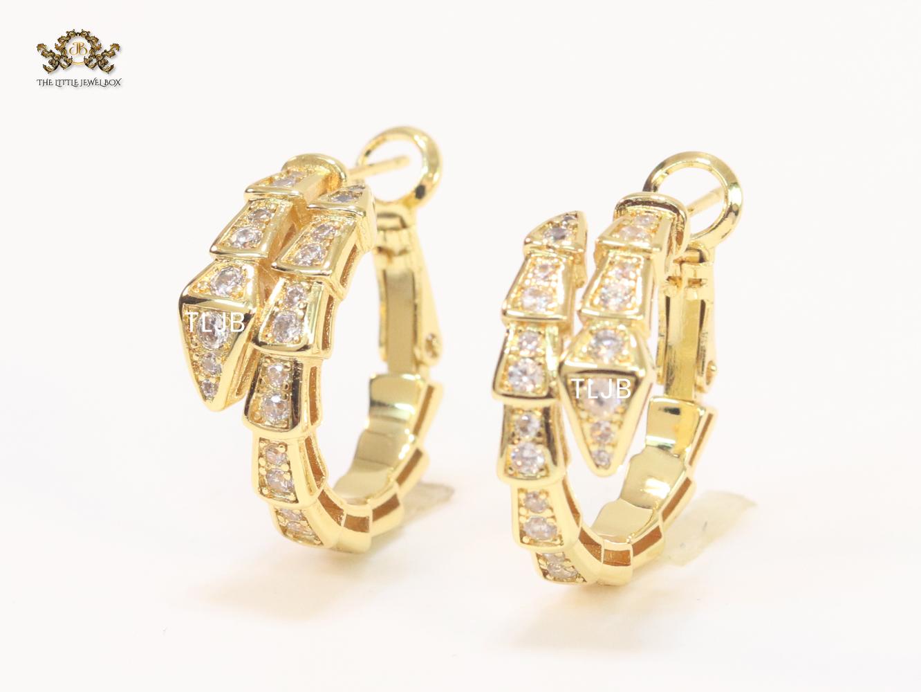 Gold serpentine hoops