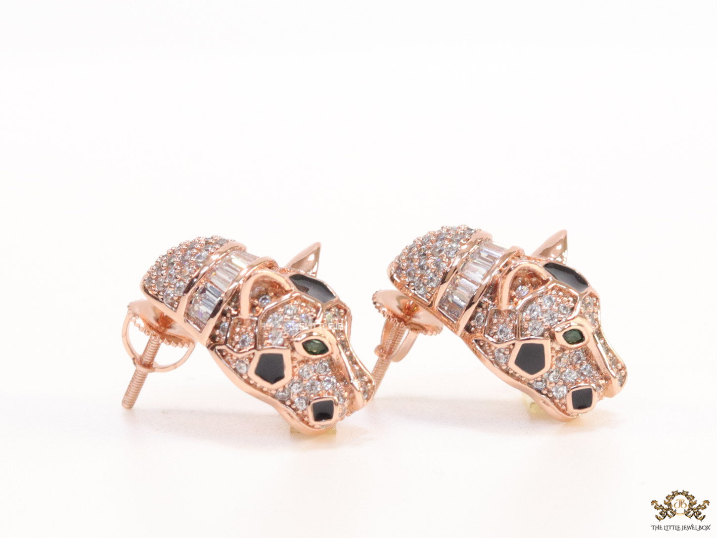Asymmetrical cz and baguette panther studs in rose gold finish