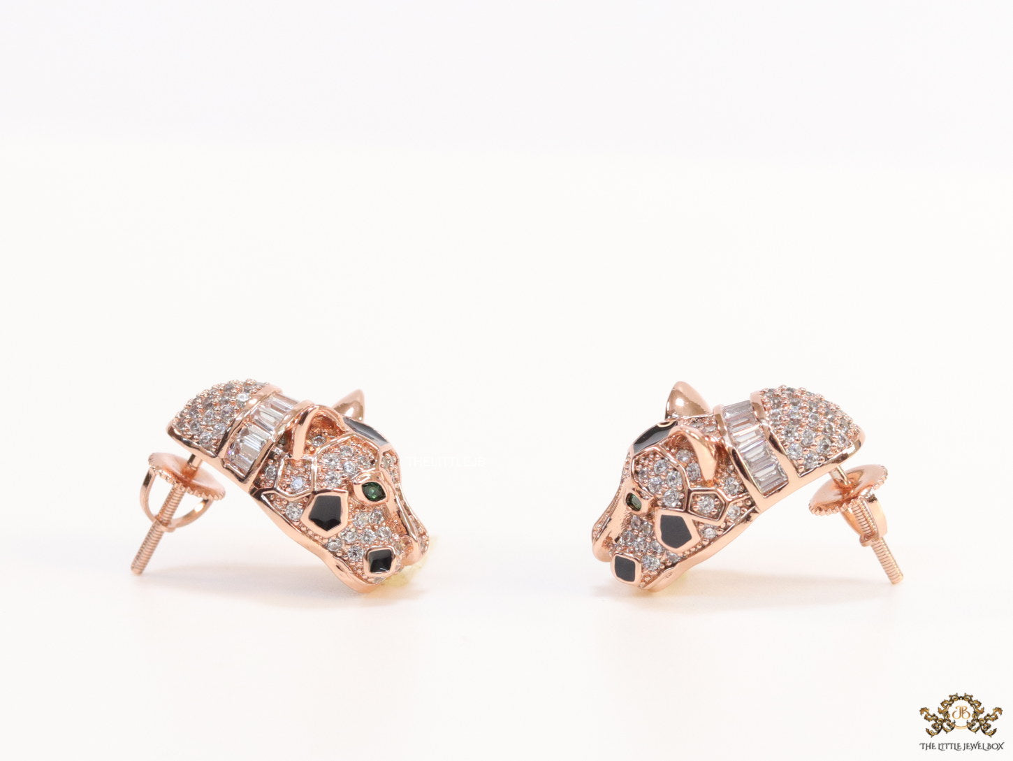 Asymmetrical cz and baguette panther studs in rose gold finish