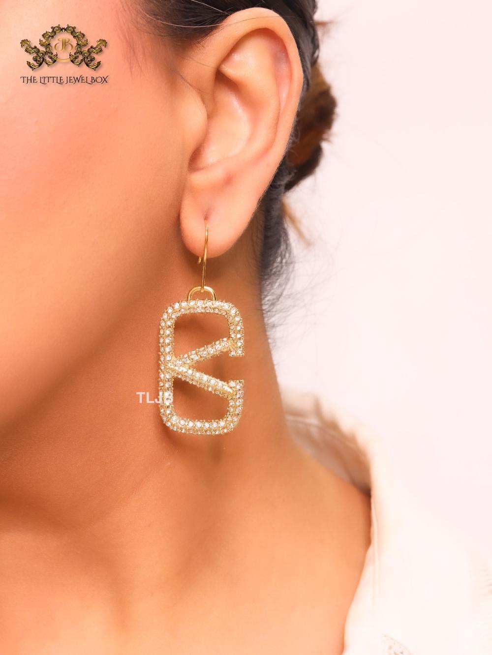 Alphabet open V cz and gold danglers