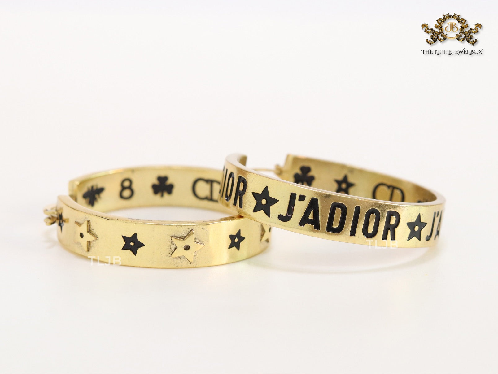 Alphabet C and D embossed on gold hoops
