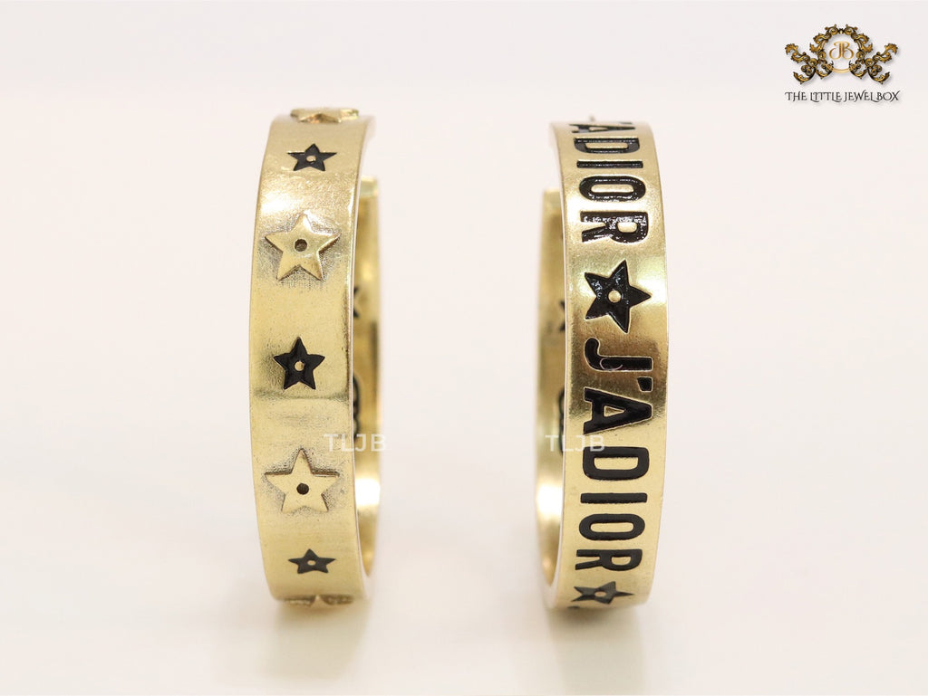 Alphabet C and D embossed on gold hoops