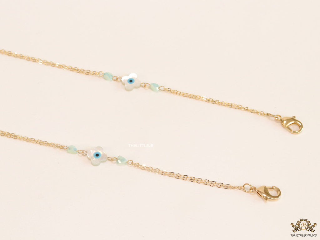 Golden mask chains with MOP evil eye clovers