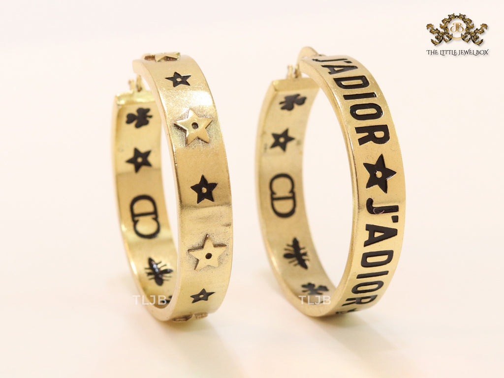 Alphabet C and D embossed on gold hoops