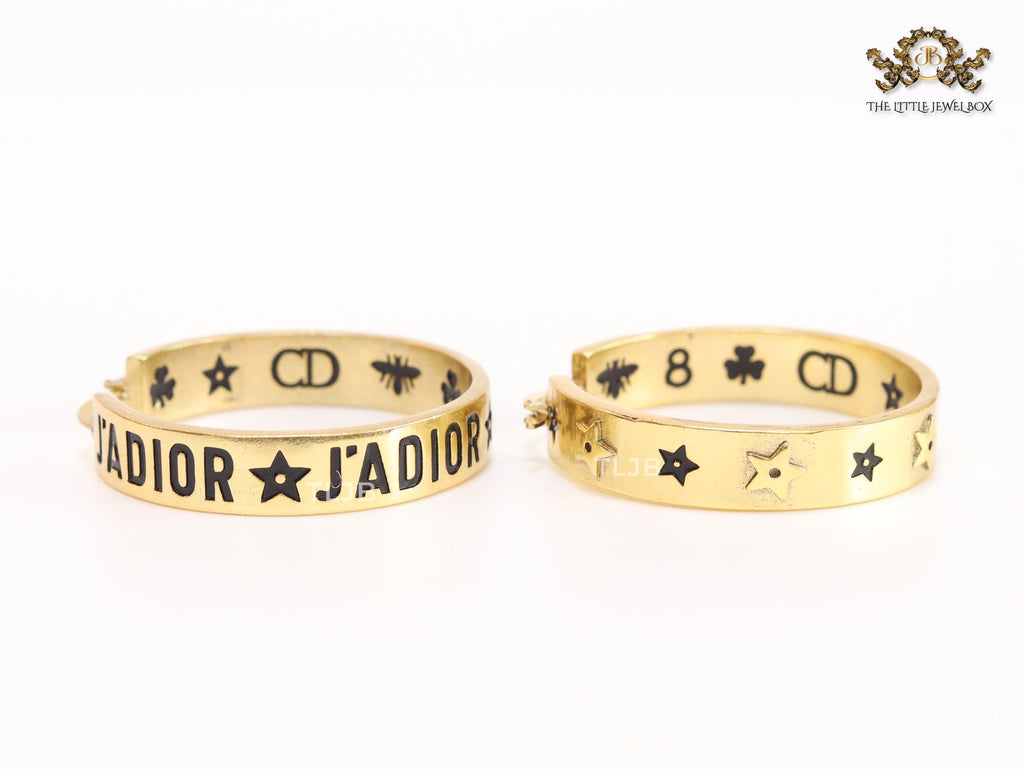 Alphabet C and D embossed on gold hoops