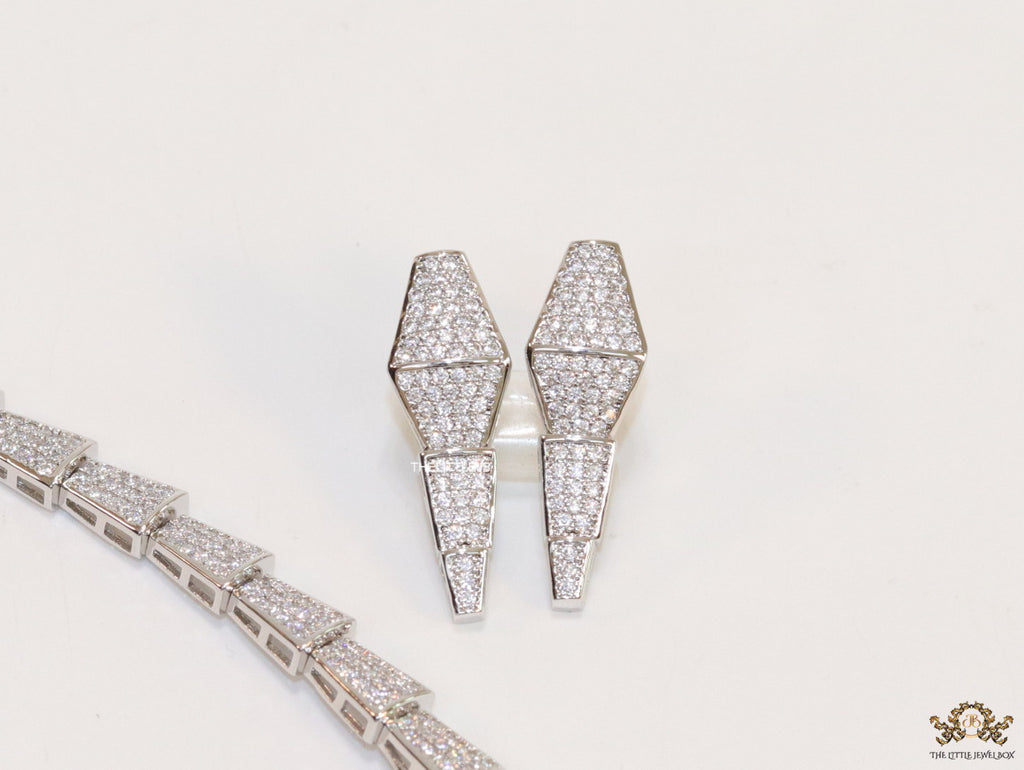 Platinum plated serpentine look knot necklace in cz
