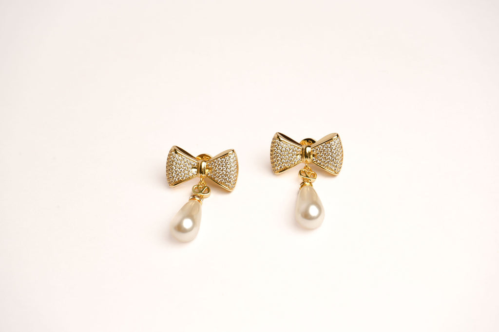 Alphabet V Bow Motif Long Pearl Dangler with CZ in Gold | Elegant Drop Earrings