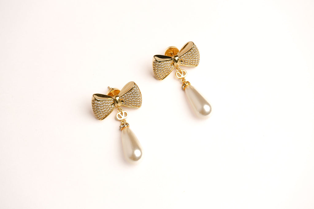 Alphabet V Bow Motif Long Pearl Dangler with CZ in Gold | Elegant Drop Earrings
