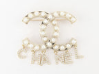Platinum Double C pearl brooch with charms