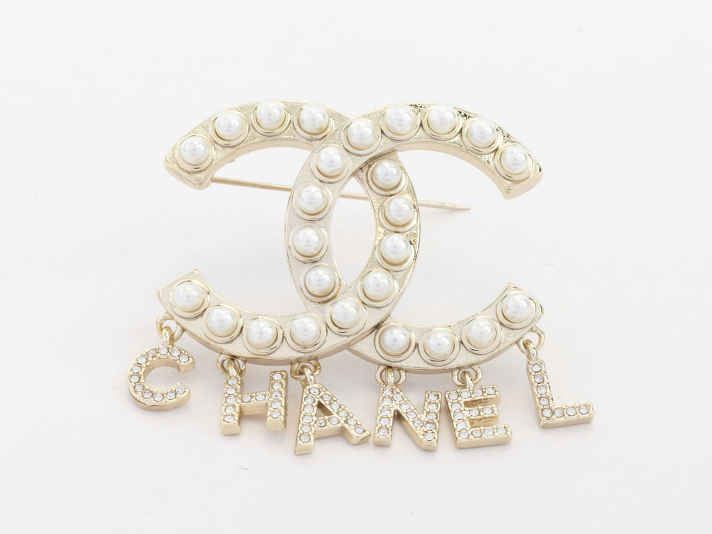 Platinum Double C pearl brooch with charms