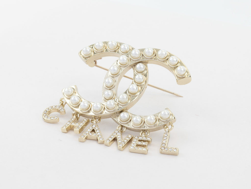Platinum Double C pearl brooch with charms