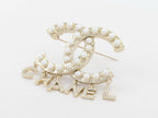 Platinum Double C pearl brooch with charms