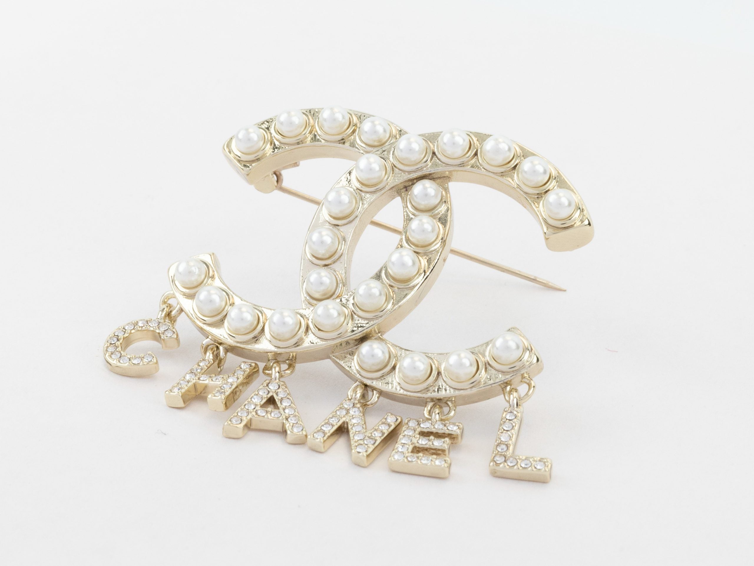 Platinum Double C pearl brooch with charms