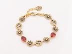 Rustic gold Double G and flowers bracelet with ruby