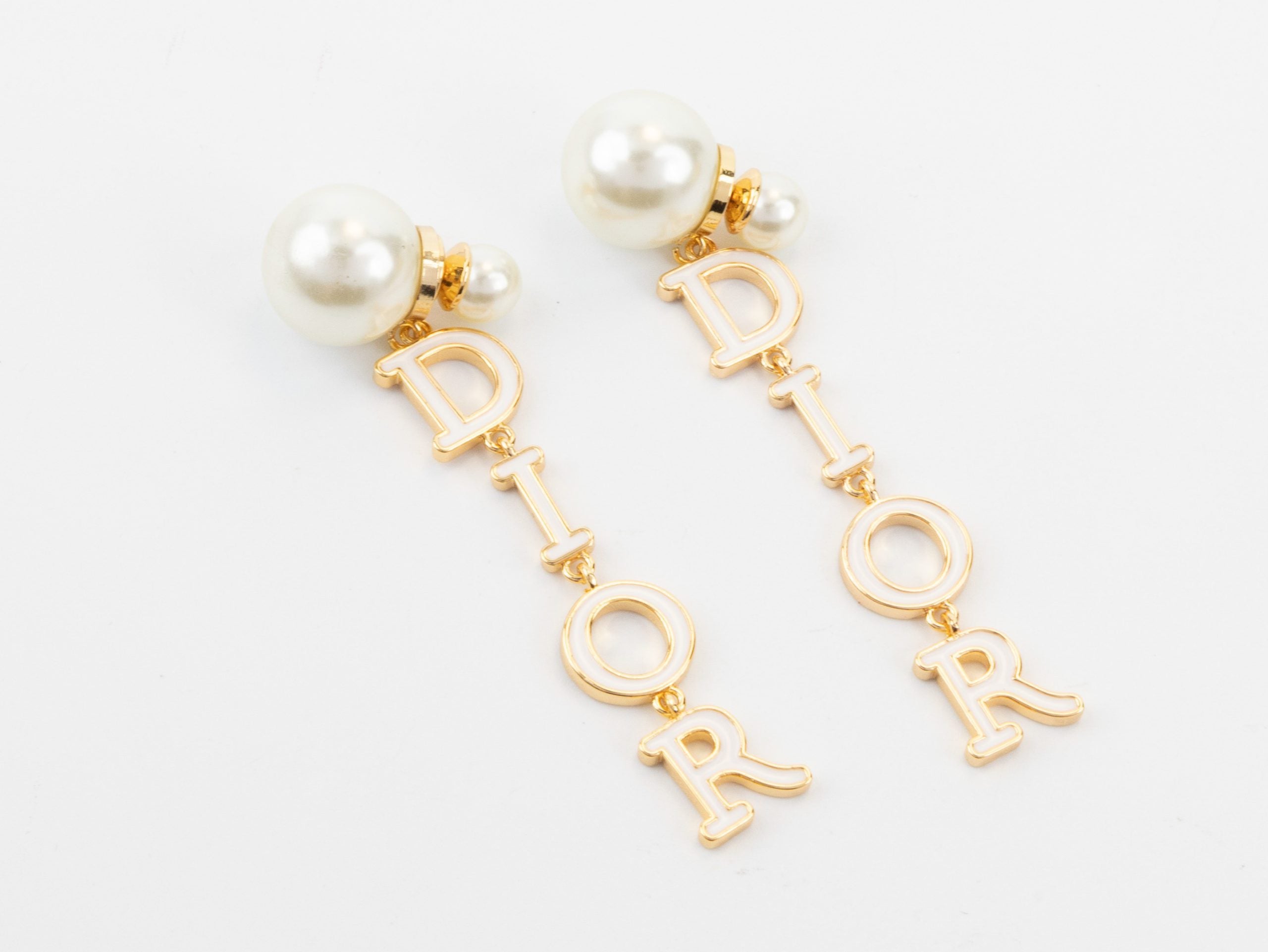 Long gold enamel alphabet C and D pearl earrings