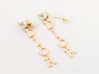Long gold enamel alphabet C and D pearl earrings