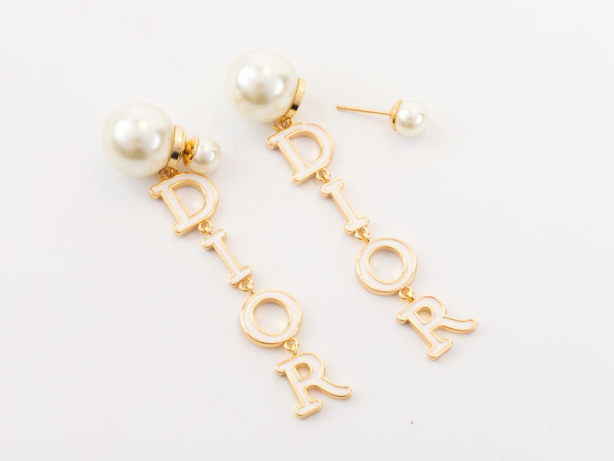 Long gold enamel alphabet C and D pearl earrings