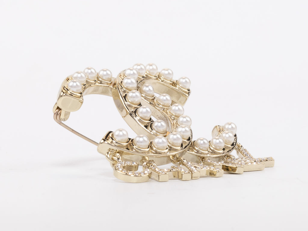 Platinum Double C pearl brooch with charms