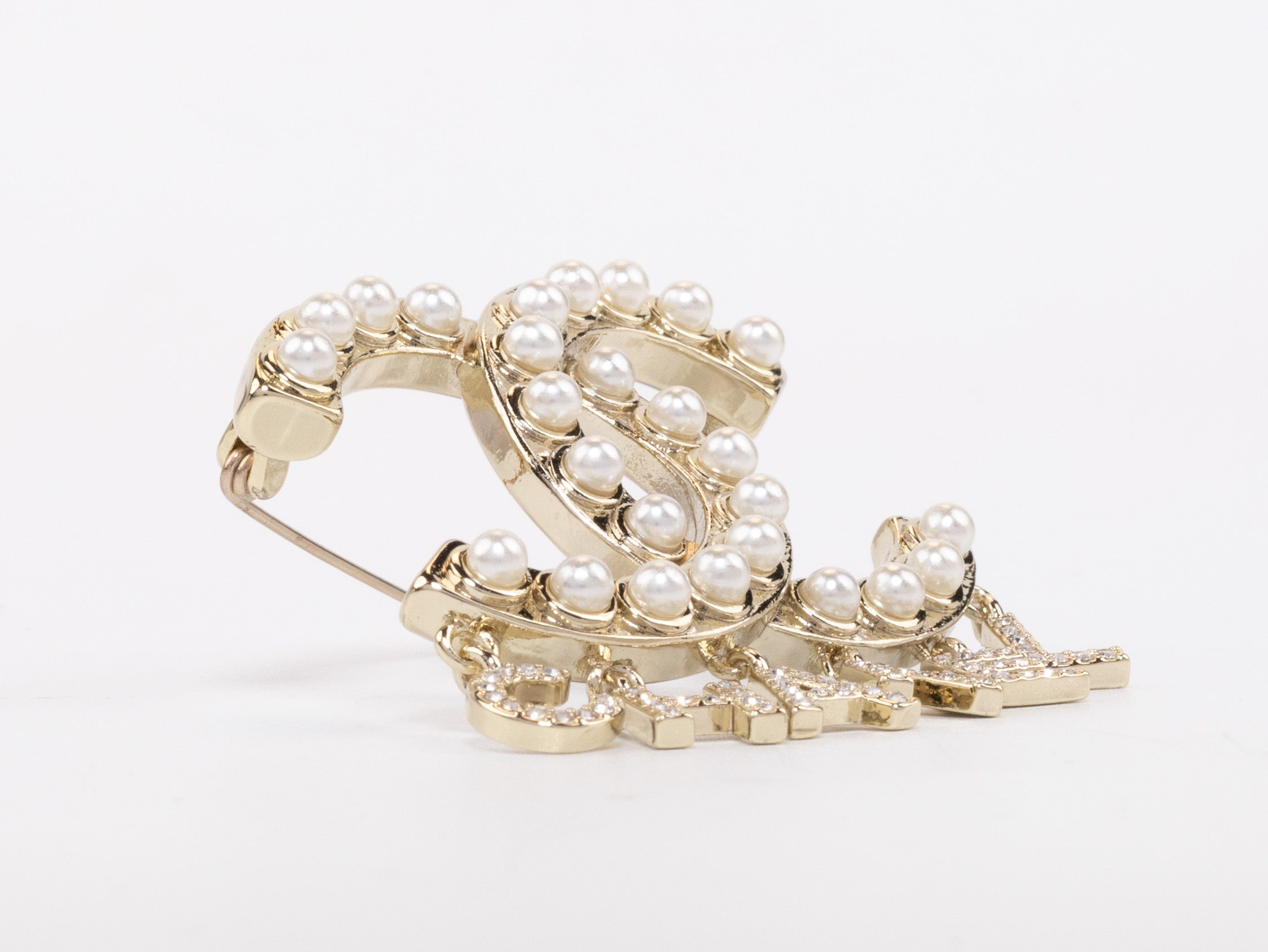 Platinum Double C pearl brooch with charms