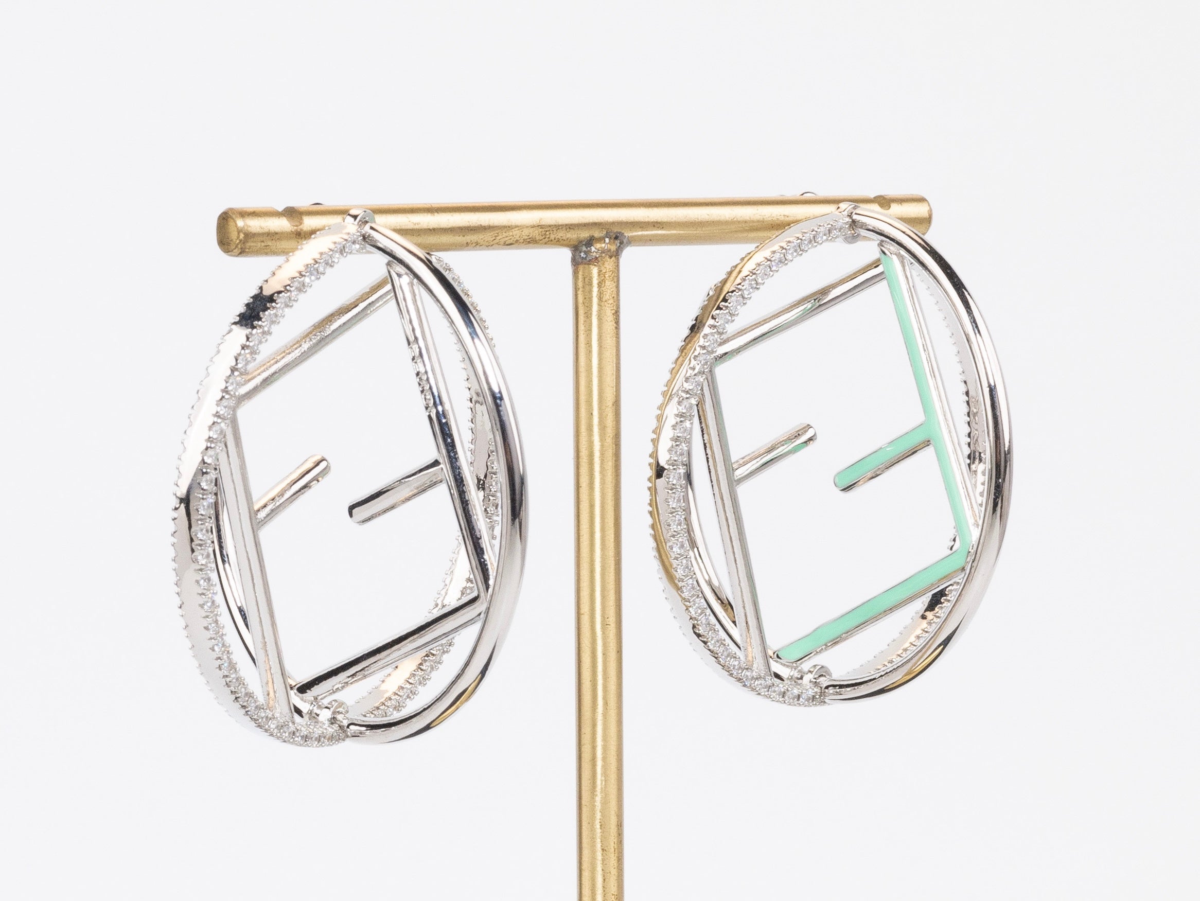 Half F platinum and green earrings hoops with CZ