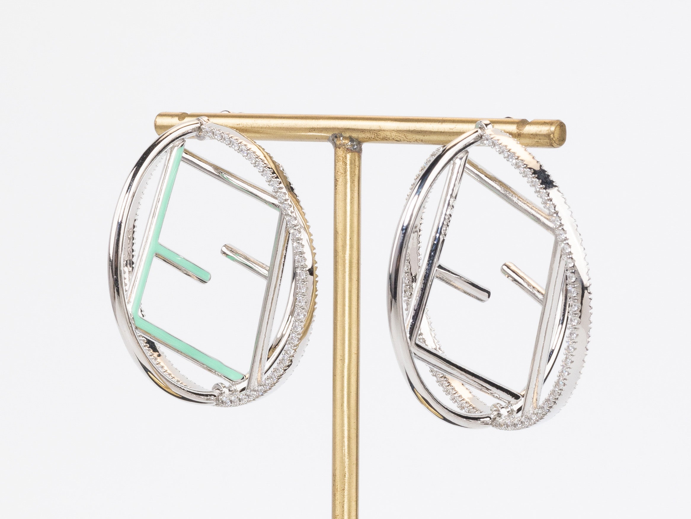 Half F platinum and green earrings hoops with CZ