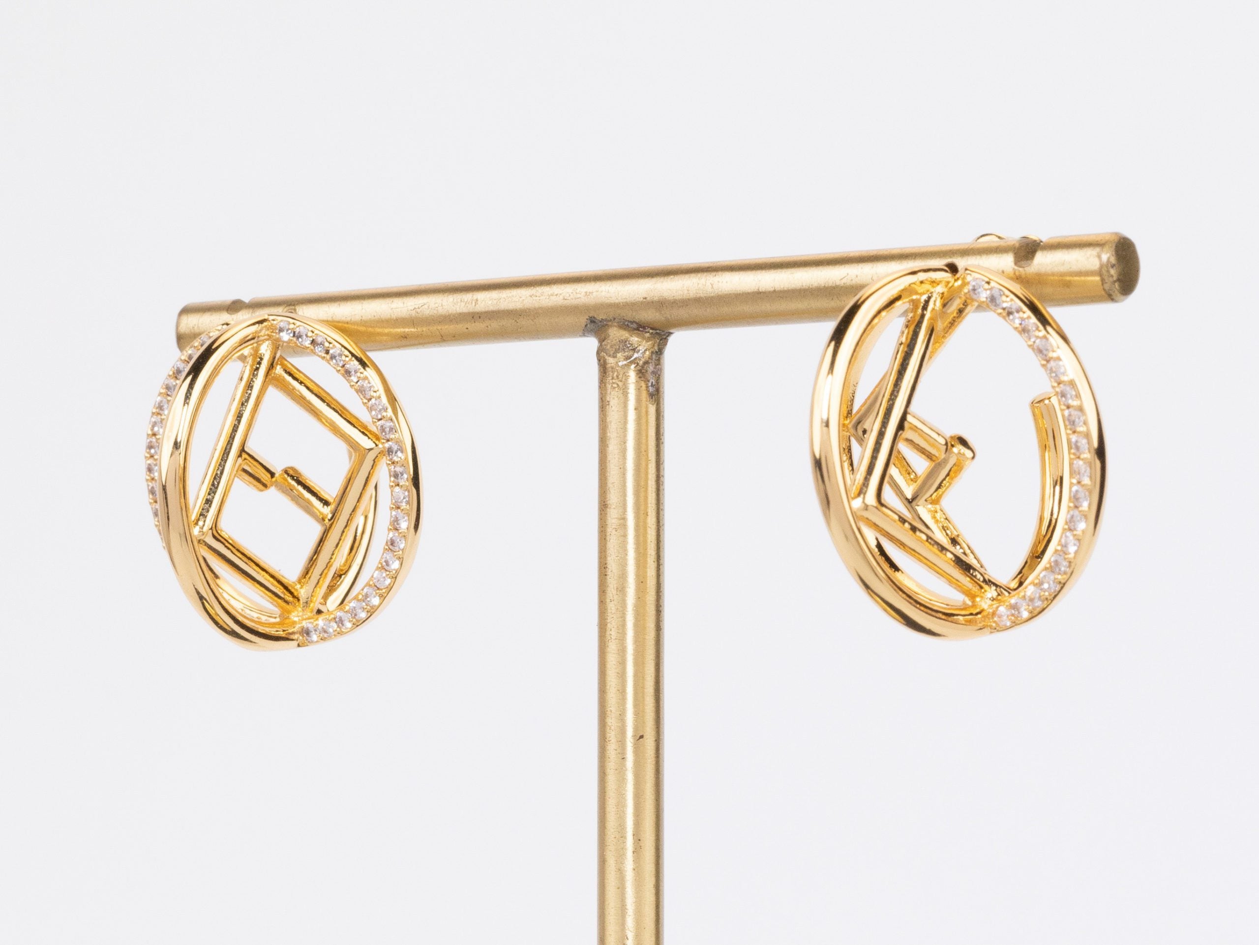 Half F gold earrings hoops with CZ