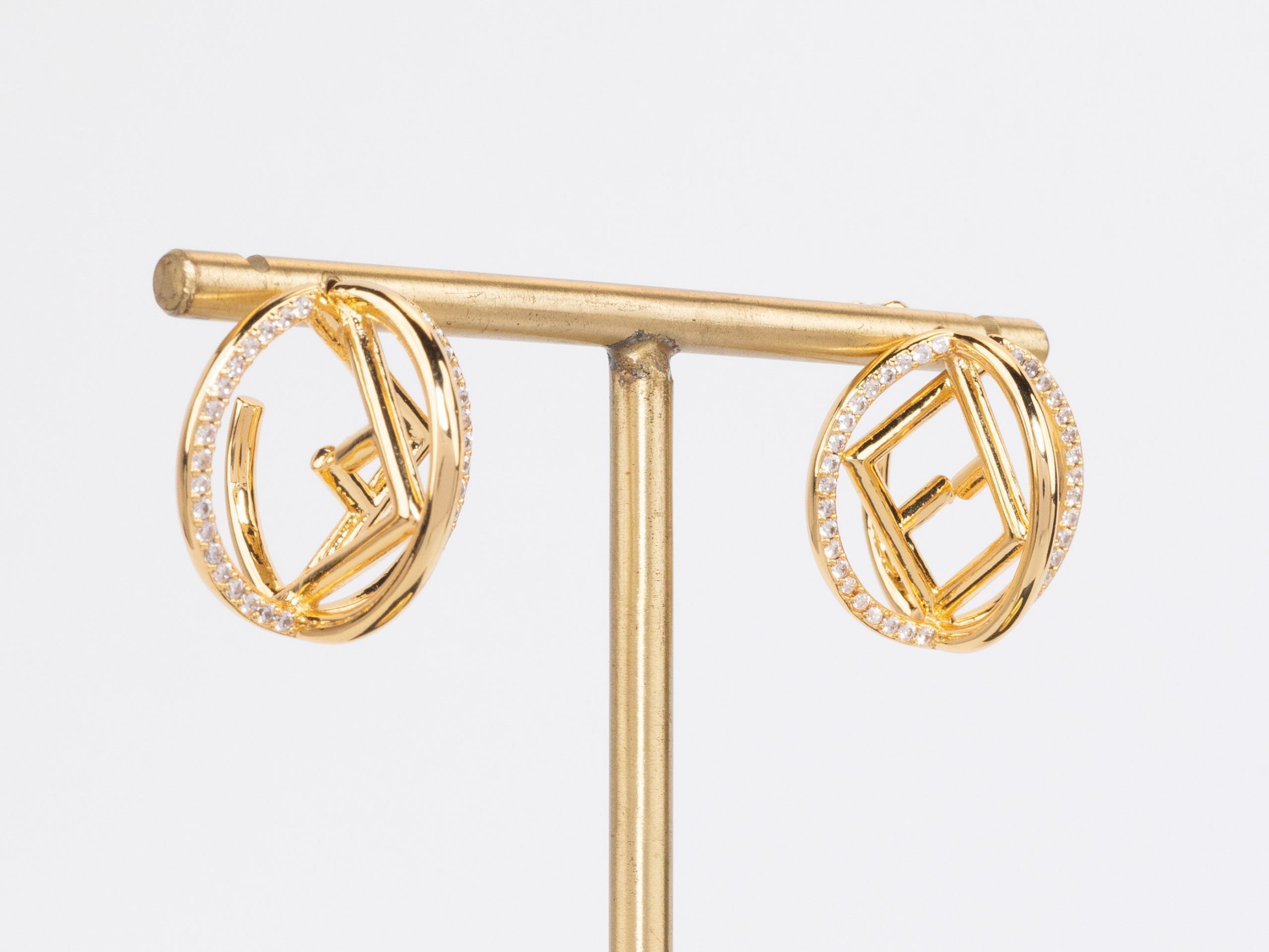 Half F gold earrings hoops with CZ