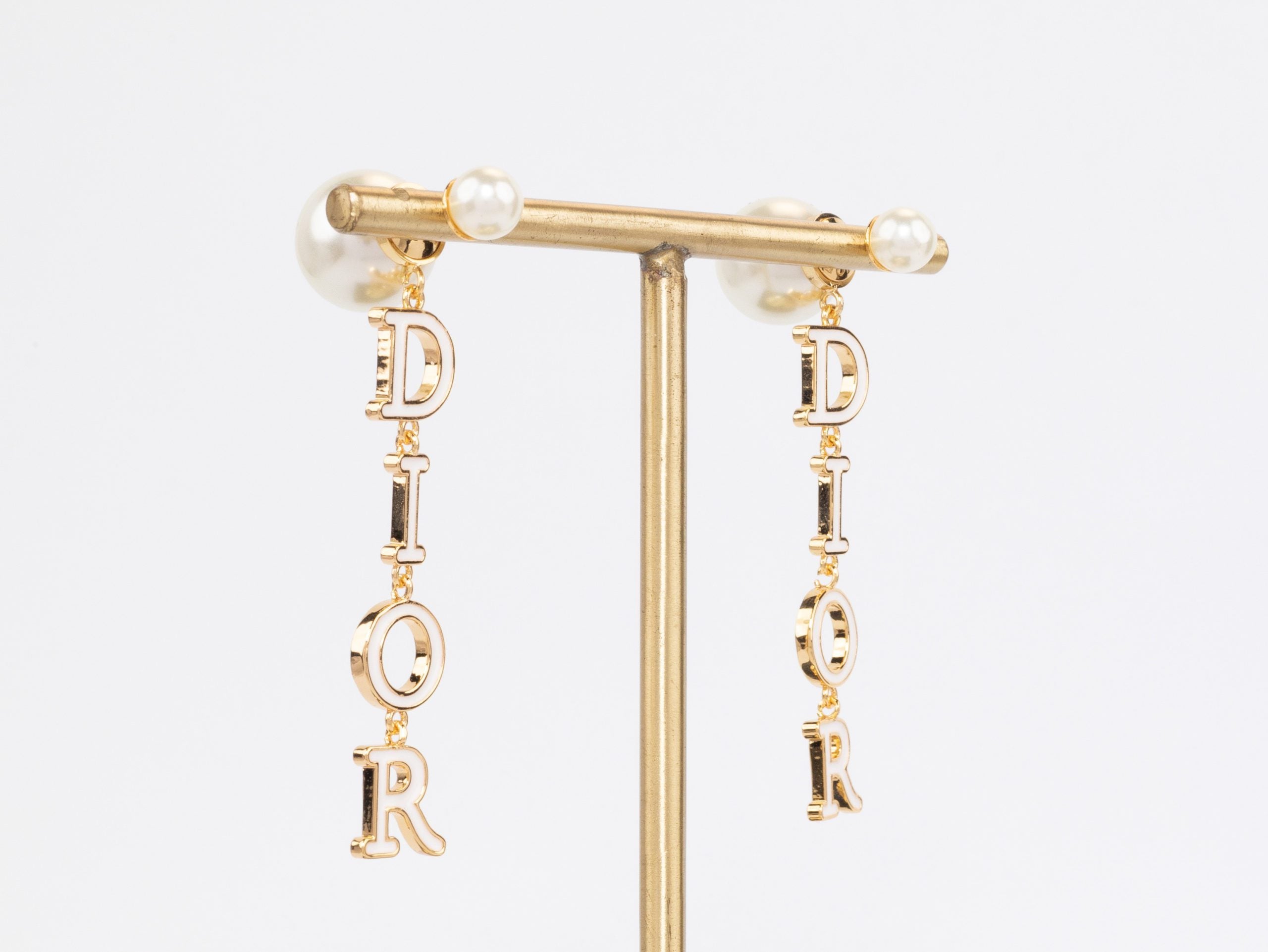 Long gold enamel alphabet C and D pearl earrings
