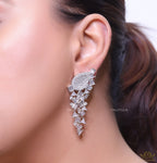 Cz and baguette dangles in platinum finish