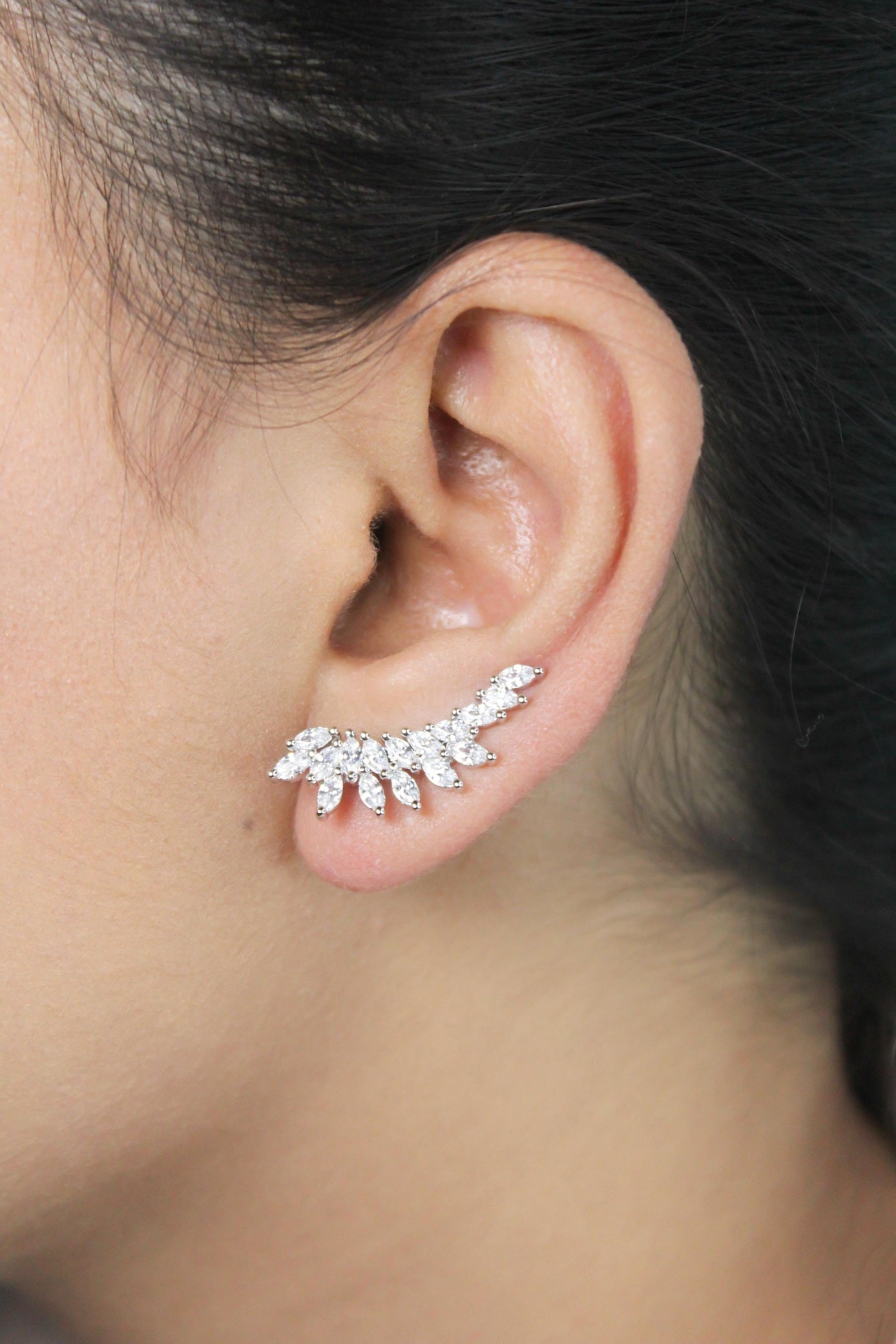 Diamond-Studded Leaf Climber Earrings in silver