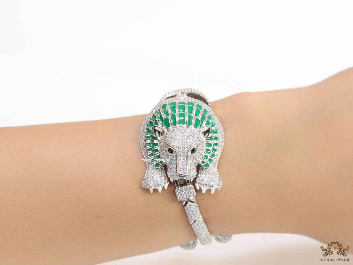 Platinum plated unique panther bracelet with cz and emerald green stones