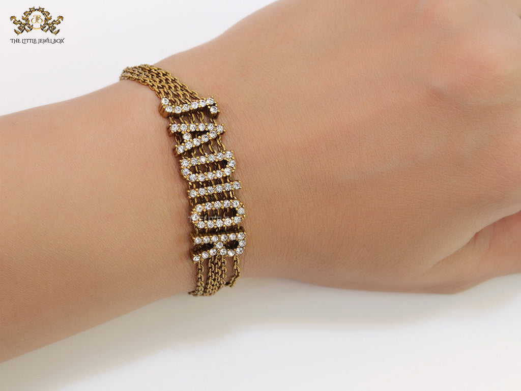 Multichain bracelet with cz alphabets in antique gold finish